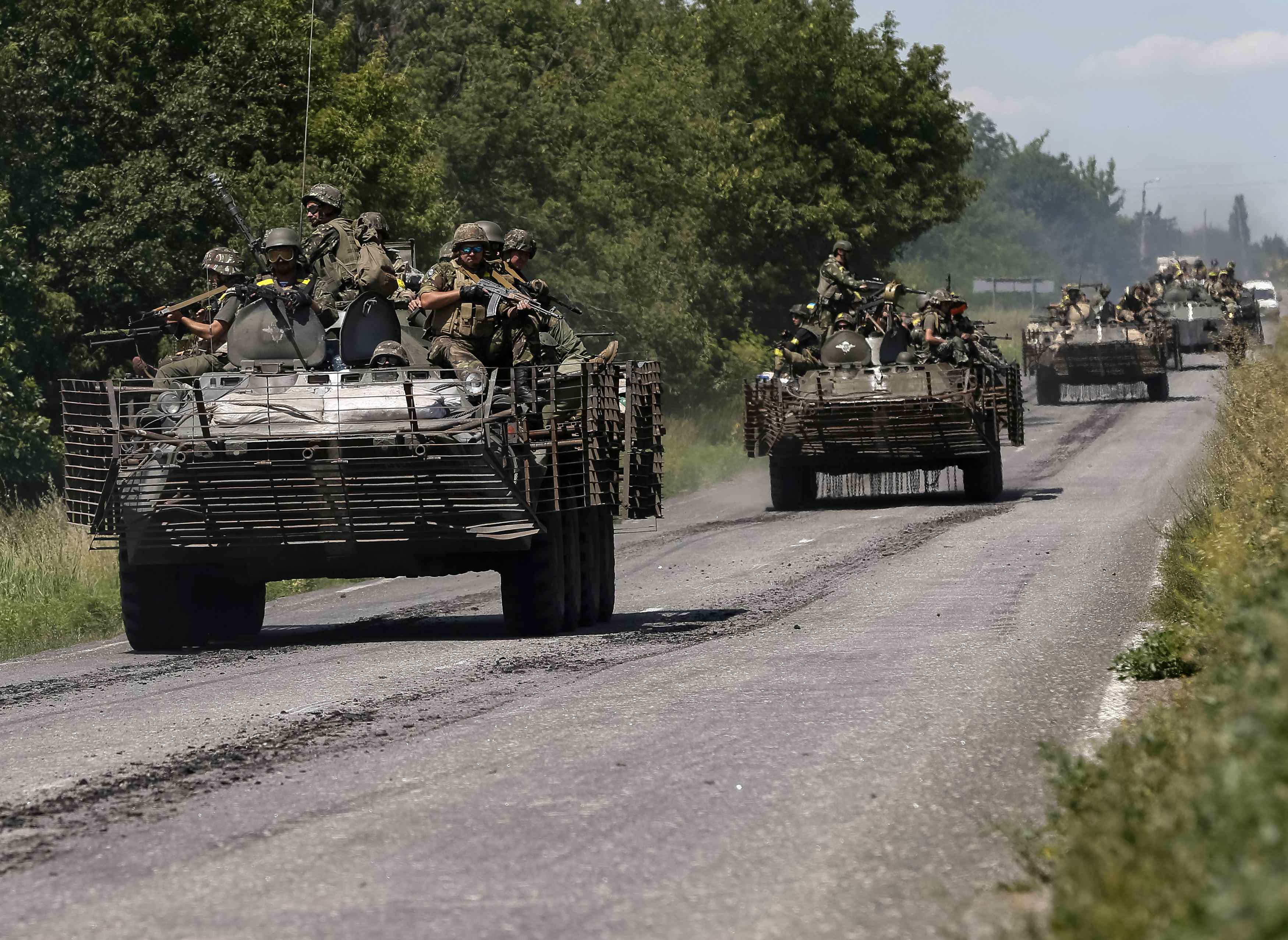 Ukrainian troops are seen on a road in the eastern Ukrainian town of Konstantinovka