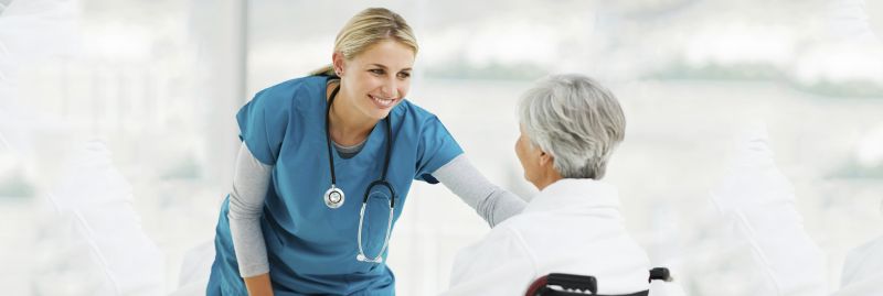 Young Doctor Speaking With an Elderly Patient