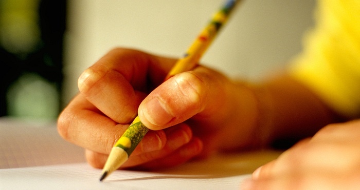 Young person writing