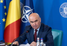 Bolojan vrea să înghețe pensiile și salariile