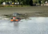 VIDEO Lacul de acumulare de pe Jiu, din zona Vădeni, curățat